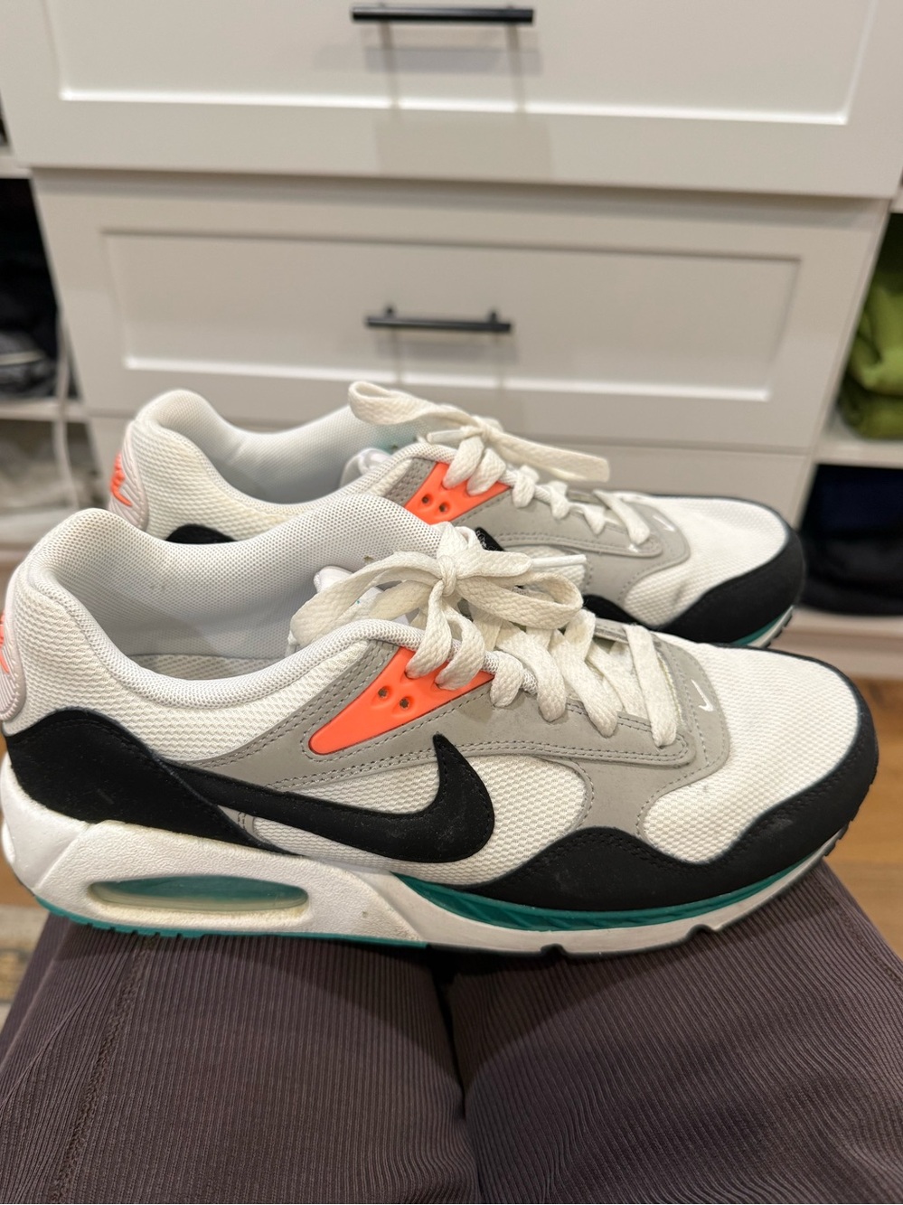 Nike women’s White Black Teal Accent Sneakers with Orange Eyelets